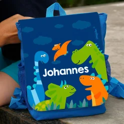 blauer Kinderrucksack mit Dinosauriern und Ihrem Namen
