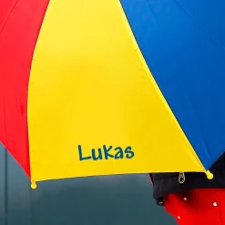 Bunter Kinderschirm mit Ihrem Wunschnamen bedruckt