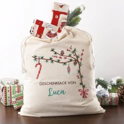 Festlicher Geschenksack mit Zweigen und Wunschtext