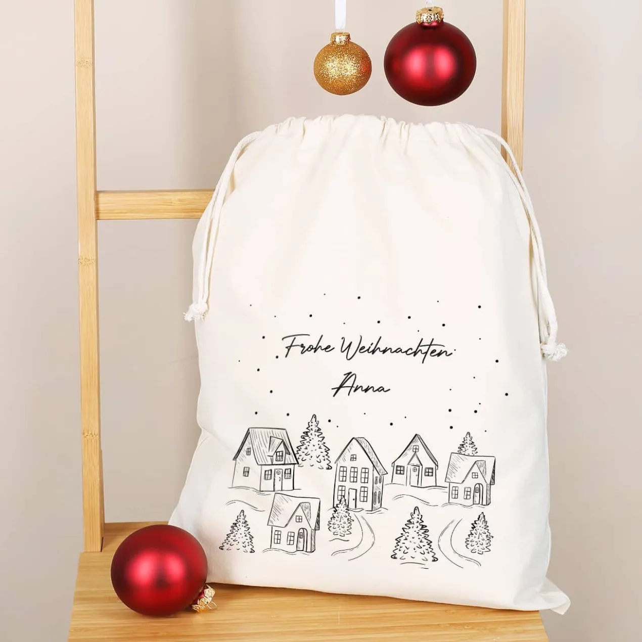 Geschenksack - verschneite Stadt - in 2 Größen mit Ihrem Wunschnamen bedruckt