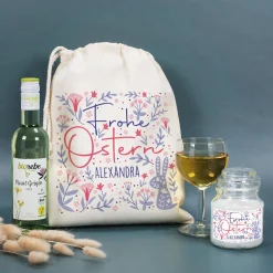 Geschenkset zu Ostern mit Duftkerze und Wein im Geschenksack