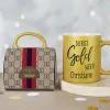Goldtasse "Du bist Gold wert" mit Name in Tassentasche im Designer-Look