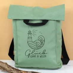 Leichter 2-in-1 Rucksack & Tasche mit Leuchtturm Motiv für Wandern und Urlaub | Glück kommt in Wellen