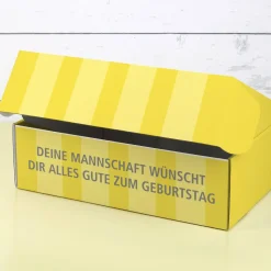Persönliche Geschenkverpackung für Dortmund Fans in gelb und mit Fußball bedruckt