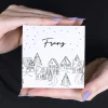 Persönliche Geschenkverpackung und 4 Lindor Kugeln mit verschneiter Stadt als Motiv