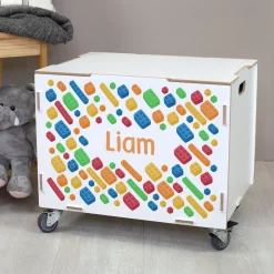 Personalisierte Rollbox aus Holz von clipfritz - Bunte Bausteinwelt | Kinder-Spielzeugkiste mit Name