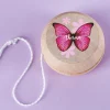 Personalisiertes JoJo aus Holz im Retrodesign für Mädchen mit Name und Schmetterling Motiv