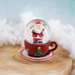 Schneekugel Weihnachtsmann auf roter Tasse