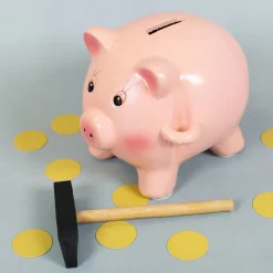 Spardose - Schwein mit Hammer