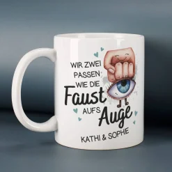 Wir zwei passen wie die Faust aufs Auge - Tasse mit Ihren Wunschnamen